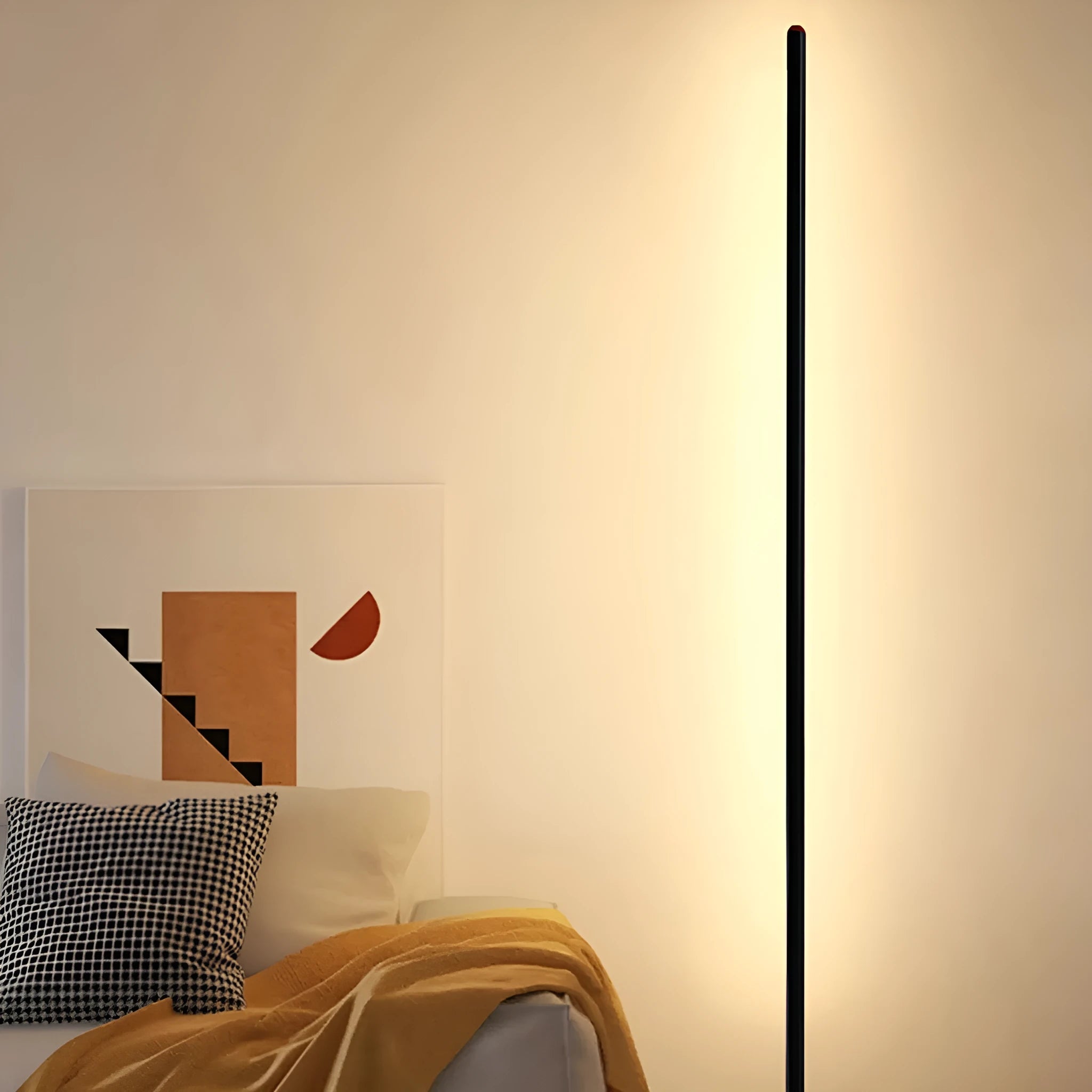 Simple modern vertical aluminium alloy floor lamp with LED light in a living room corner.