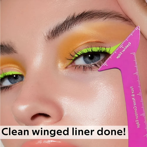 Pink reusable plastic makeup stencil with cut-outs for winged eyeliner, eyebrow arch, and face contour lines on a table.