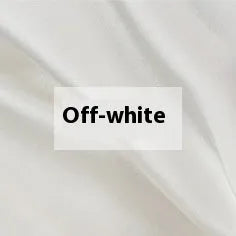 Double-sided solid colour silk duvet cover in bright brown laid flat on a bed.