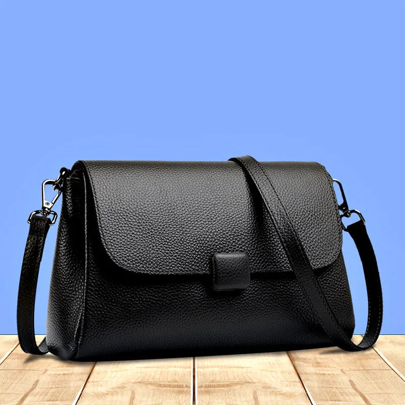 Genuine first-layer cowhide leather shoulder bag in horizontal square shape, 26x16x9cm, black colour, with top zipper and sandwich pocket