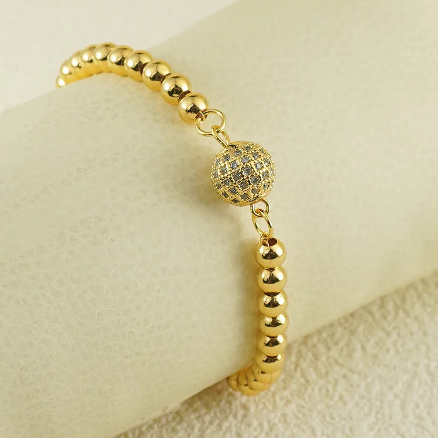 Women's Arabic-style copper bracelet with a heart shape and single zircon ball accent.
