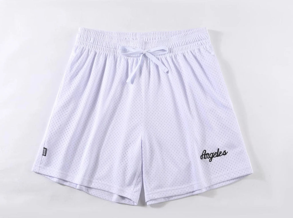Man wearing black double-layer mesh sports shorts, showing mesh panel detail and short length for running.