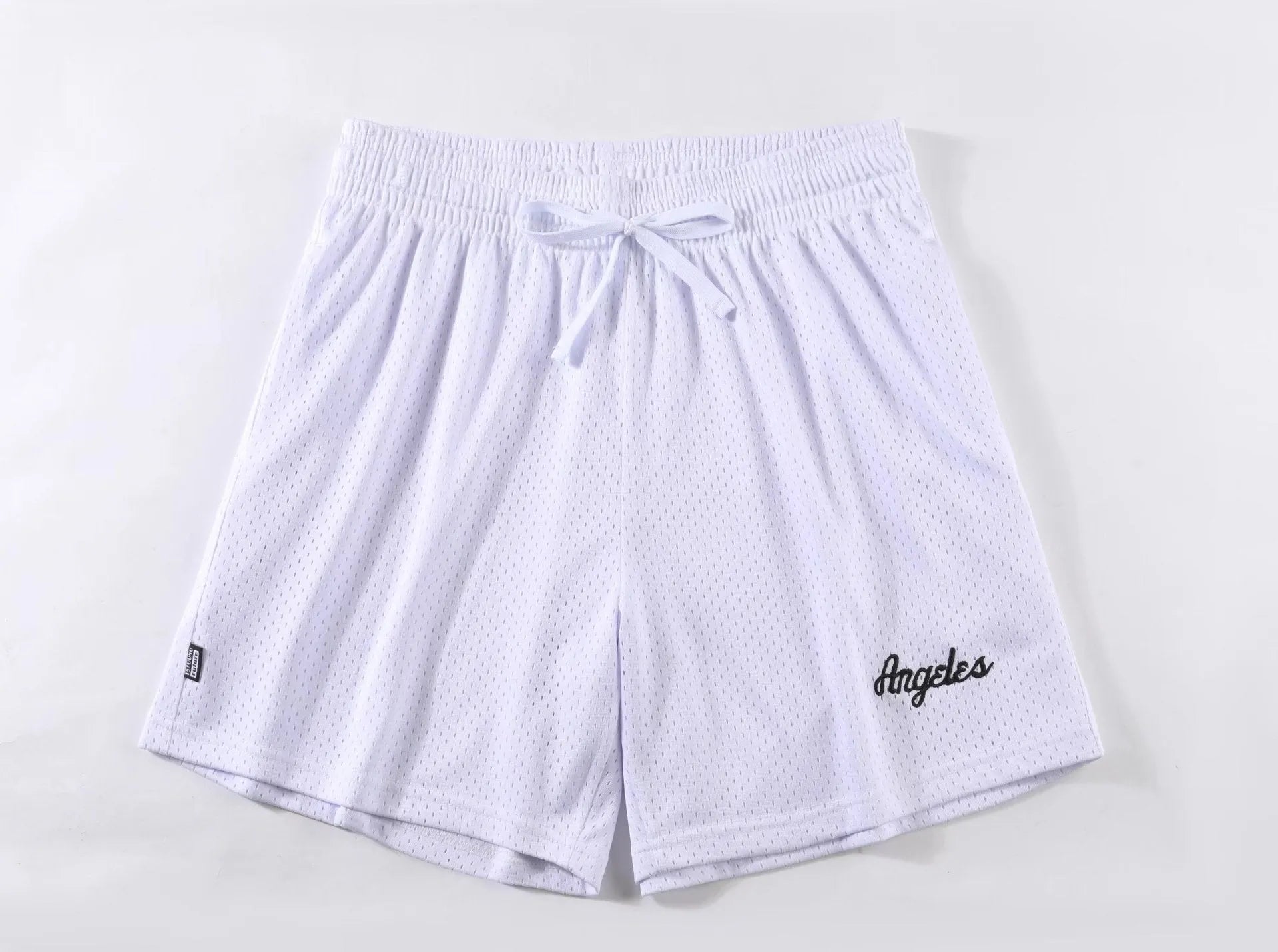Man wearing black double-layer mesh sports shorts, showing mesh panel detail and short length for running.