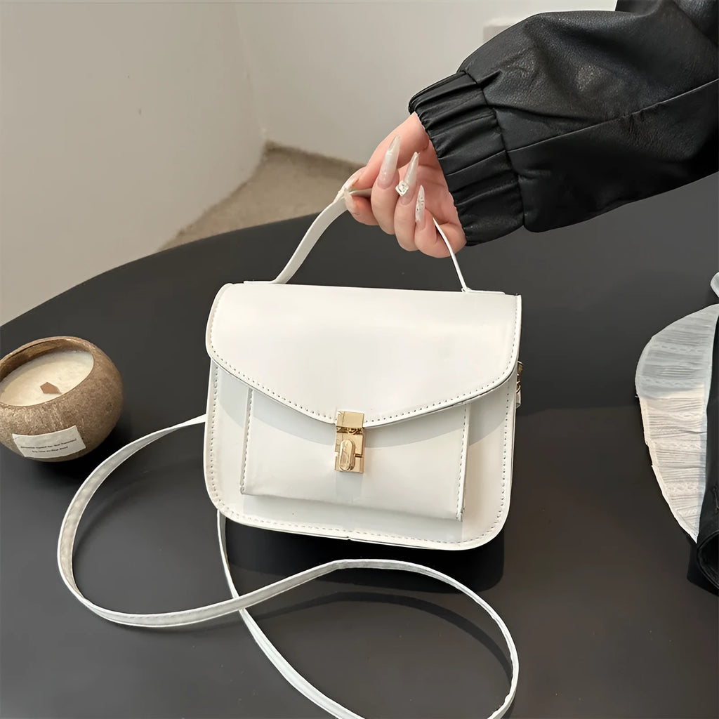 Horizontal square PU leather messenger bag in urban style with crossbody strap and sewing line detail.
