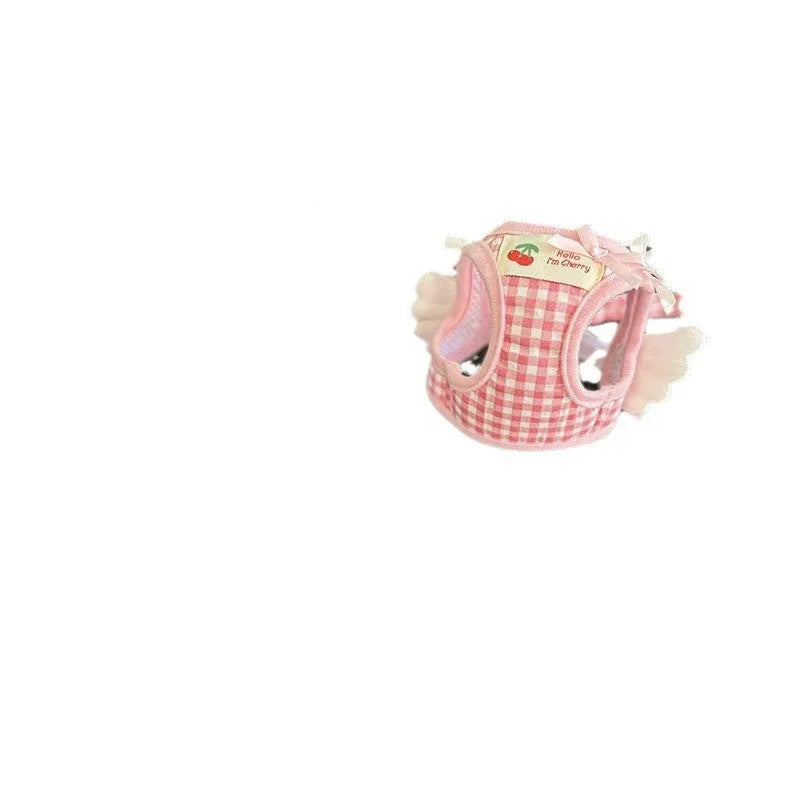 Small dog wearing pink cotton chest and back harness with adjustable straps