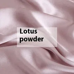 Double-sided solid colour silk duvet cover in bright brown laid flat on a bed.