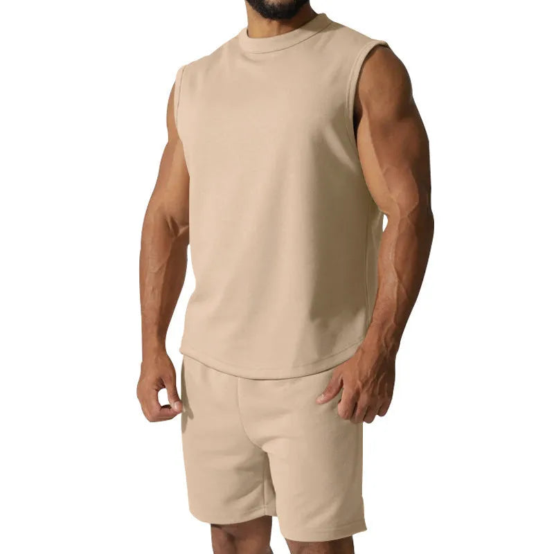 Men's sleeveless cotton blend sports top and matching shorts in a solid colour, laid flat.