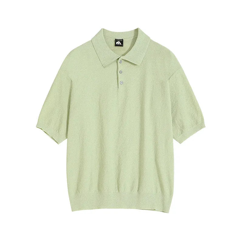 A caramel coloured men's loose-fit knitted polo shirt with short sleeves on a hanger.