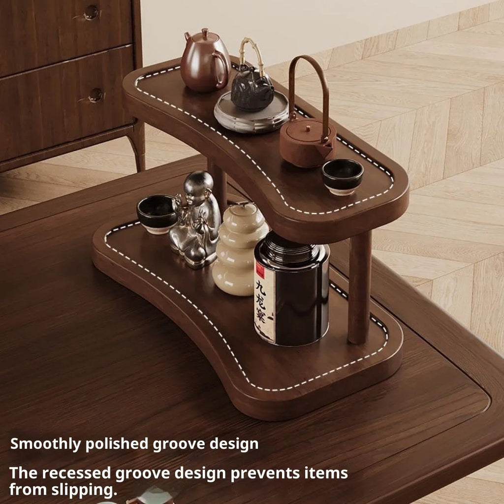 Two-layer bamboo cup storage rack on a tabletop with small items organised on both tiers