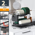 White double-layer kitchen storage rack with removable draining section on a countertop.