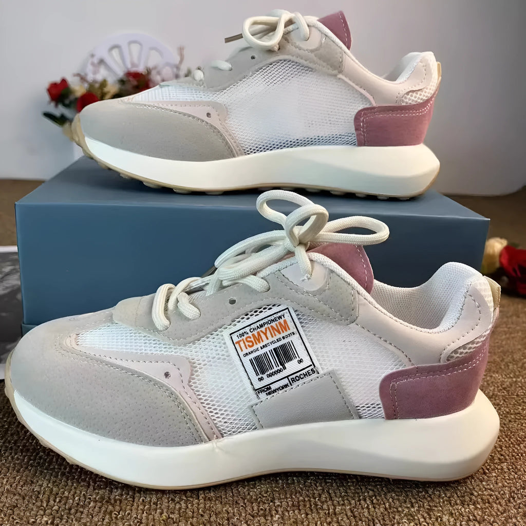 Women's grey and pink retro sneaker with low-top design and flat rubber sole