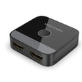 Grey alloy computer video cable adapter splitter box for HD TV connection.