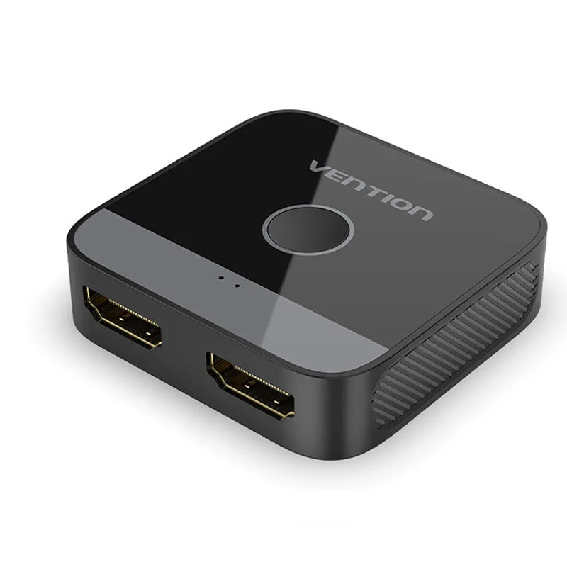 Grey alloy computer video cable adapter splitter box for HD TV connection.