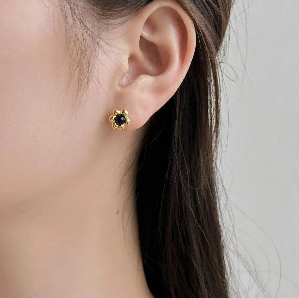 S925 sterling silver black agate flower ear studs in gold colour close up