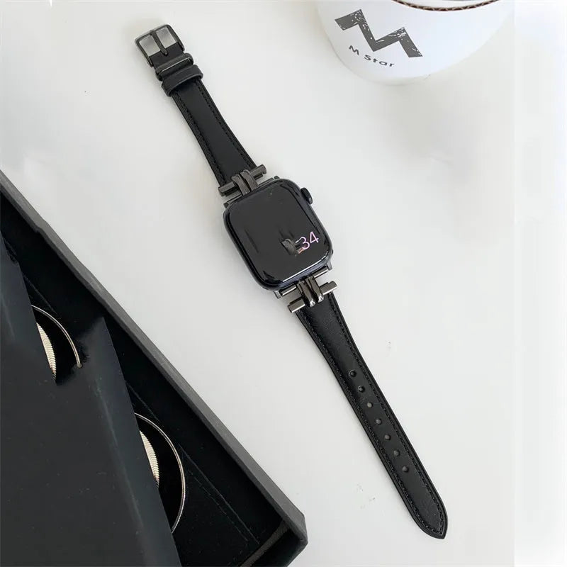 Genuine leather Apple Watch strap with metal stitching in brown colour on a dark background