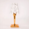 Rose gold portable touch control night light on a surface, showing its acrylic lamp holder.