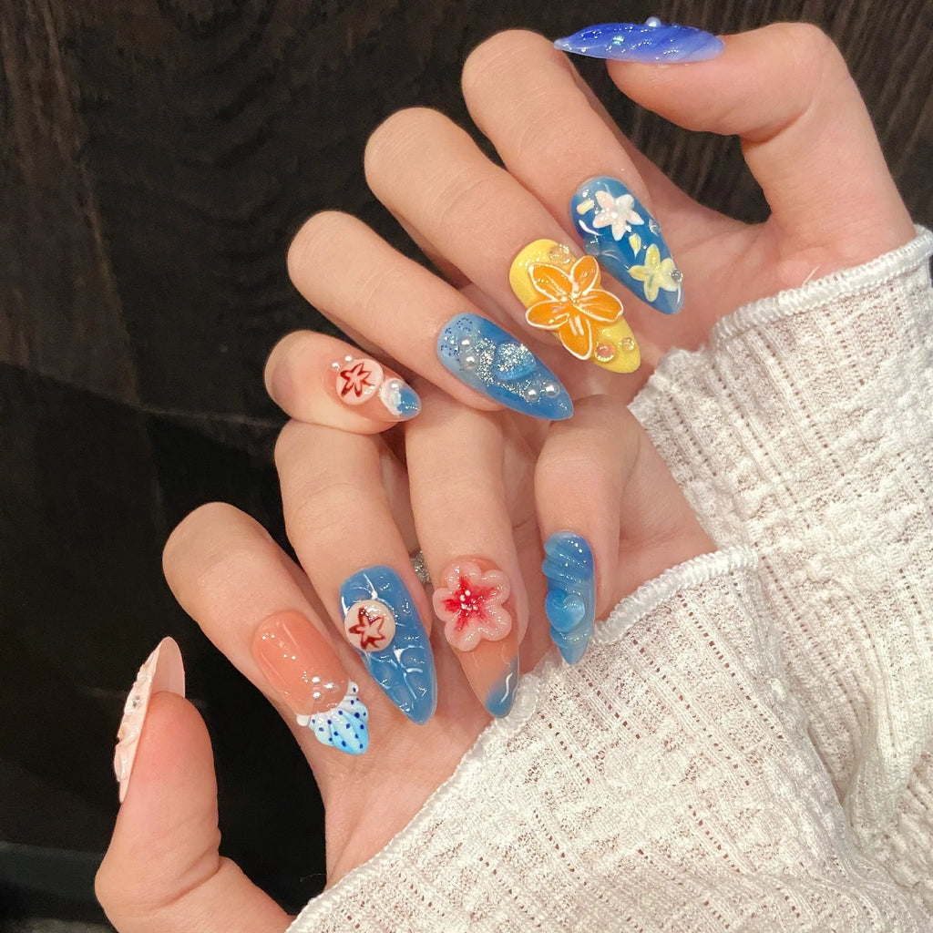Three-dimensional carved jellyfish design plastic armour set in almond nail colour with marine styling