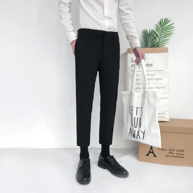 Men's slim straight-leg cotton trousers in black with a drawstring waist.