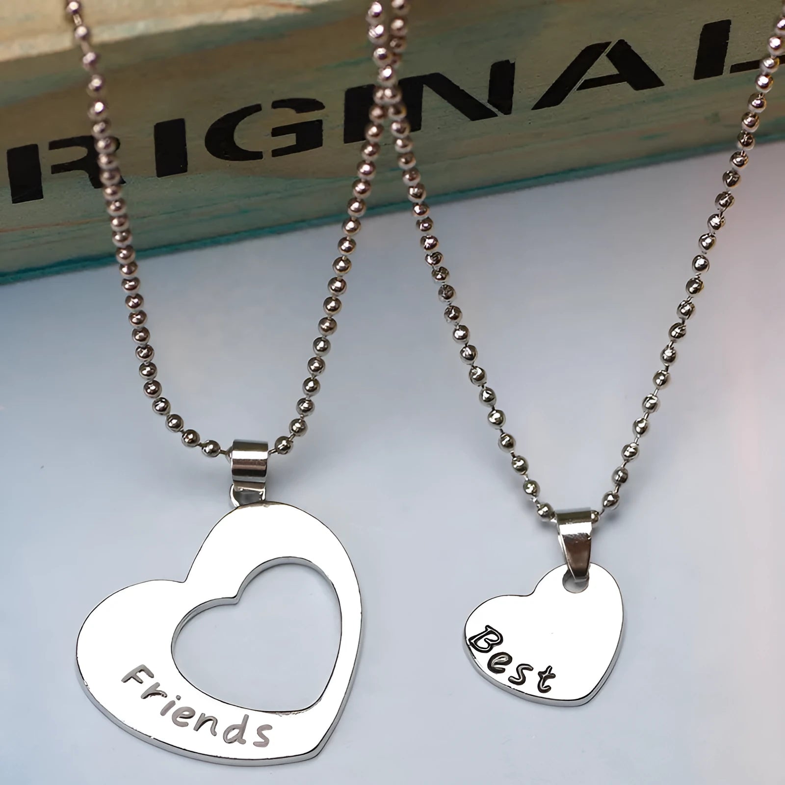 Two silver heart-shaped alloy puzzle necklaces on a cross chain, set of two, women's jewellery