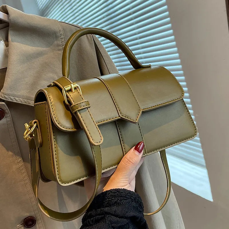 Beige women's horizontal square messenger bag with sandwich pocket and file organiser interior.
