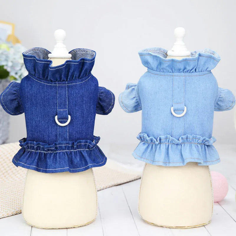 Dark blue denim dog dress with ruffles and a metal leash hook on the chest.