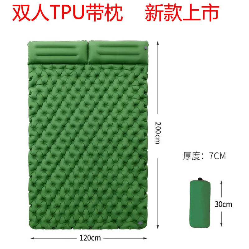 Dark blue double air mattress with built-in pump inflated on a floor, showing integrated pillow.