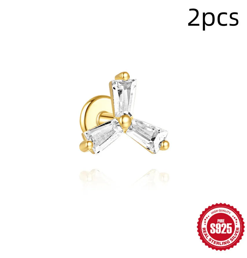 Sterling silver chain stud earrings with zircon inlay in geometric shapes including clover and crown designs