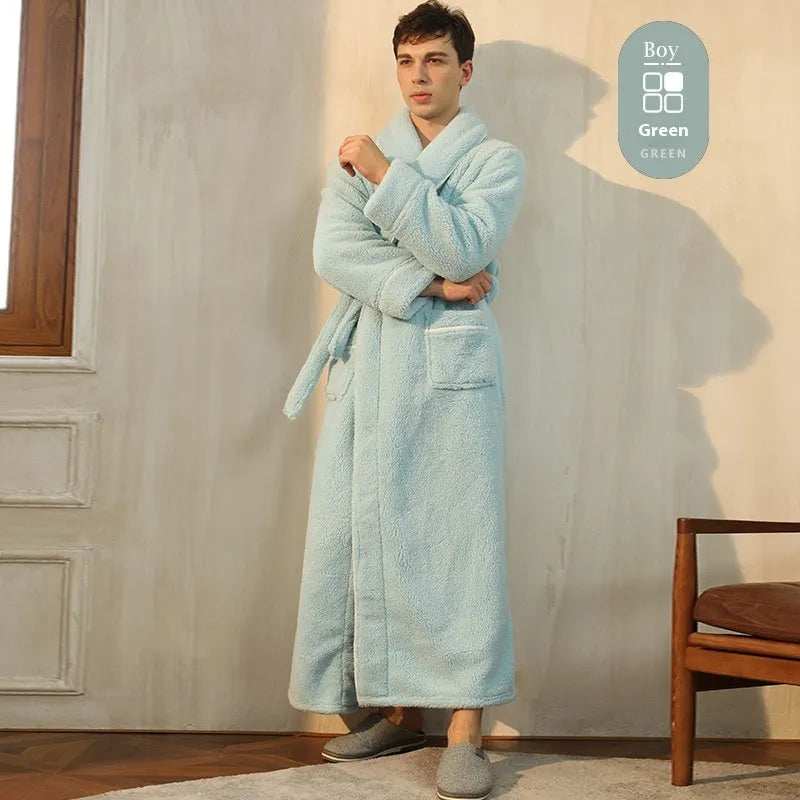 A man and woman wearing matching navy blue thick flannel bathrobes, showcasing the wrap-around design and plush fabric.