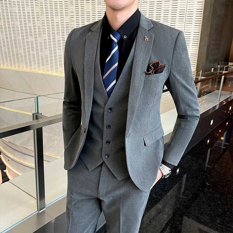 Slim fit men's business suit in British style cut, available in black or dark grey cotton blend fabric