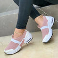 Women's lightweight mesh flat sneakers in multiple colours with a round toe and rubber sole.