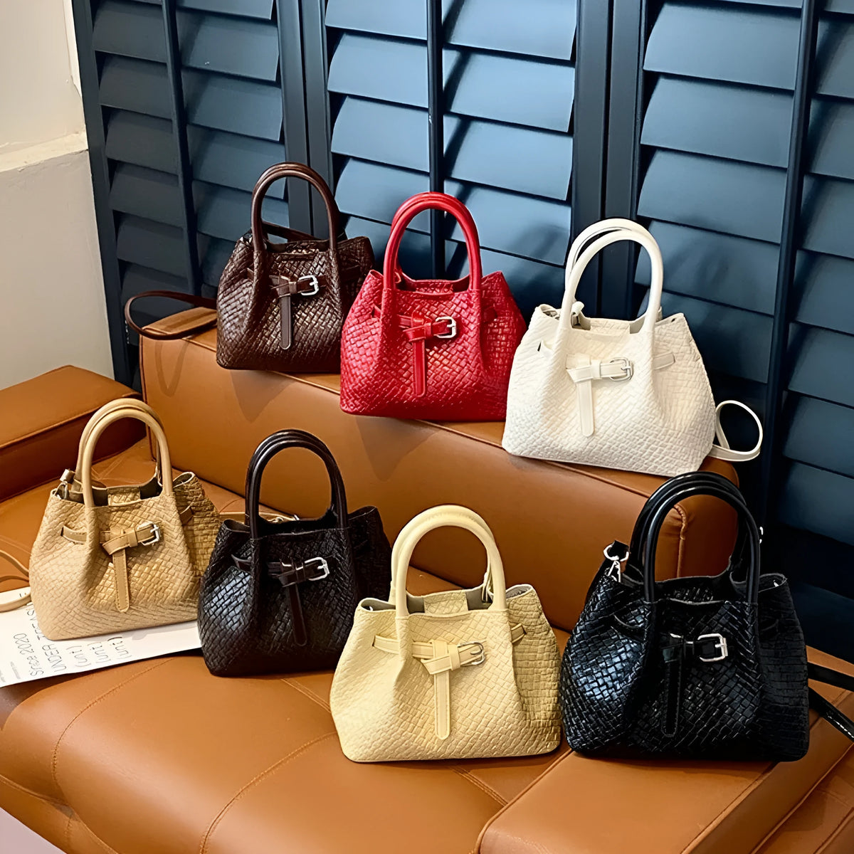 Soft PU bucket messenger handbag for women with spliced exterior and outer pocket, black colour option