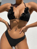 Black polyester swimwear two-piece set with a gathered design, showing the top and matching shorts.