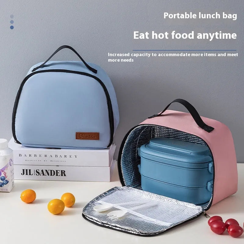 Insulated lunch bag in textured cloth material with bento handbag style and modern minimalist design