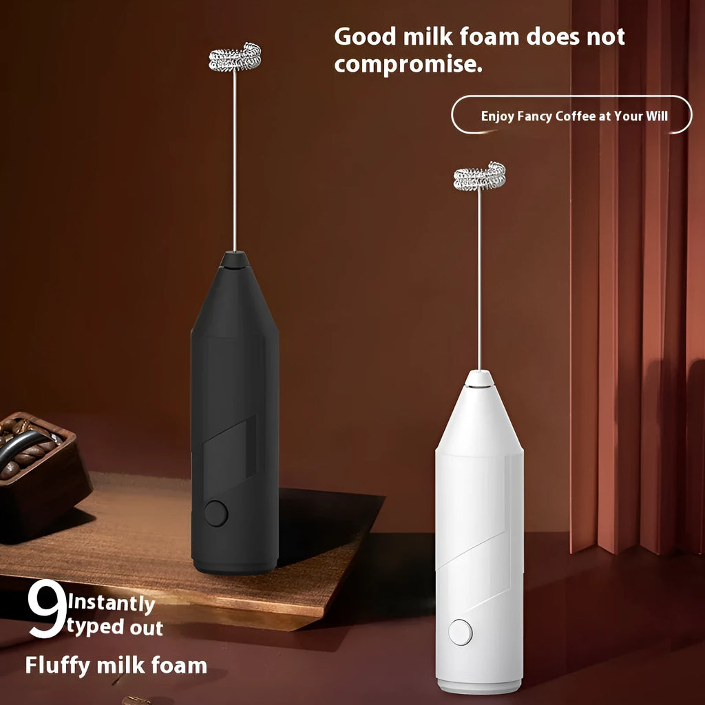 Mini handheld electric milk frother in black, white, or khaki colour with a stainless steel whisk and USB port.