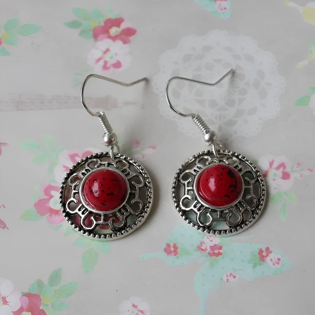 Handmade Miao silver and turquoise flower disk earrings with auspicious cloud pattern in blue.