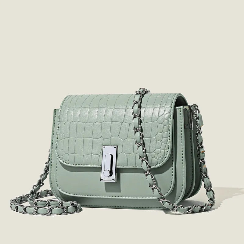 Soft PU leather women's crossbody shoulder bag in black, shown with a phone in the interior pocket.