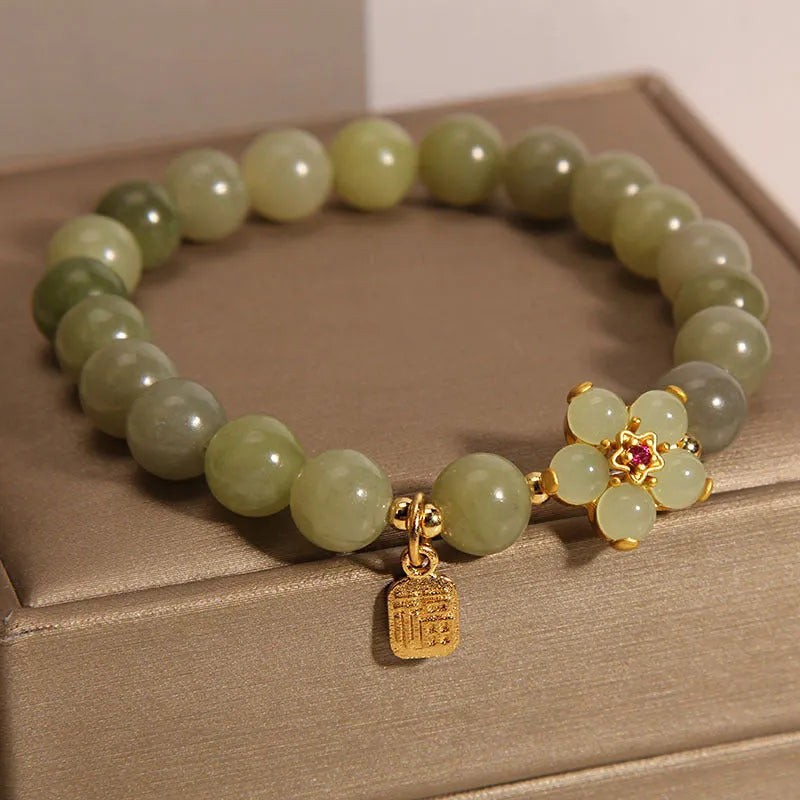 Women's alloy bracelet in grey jade colour with clasp closure for casual wear.