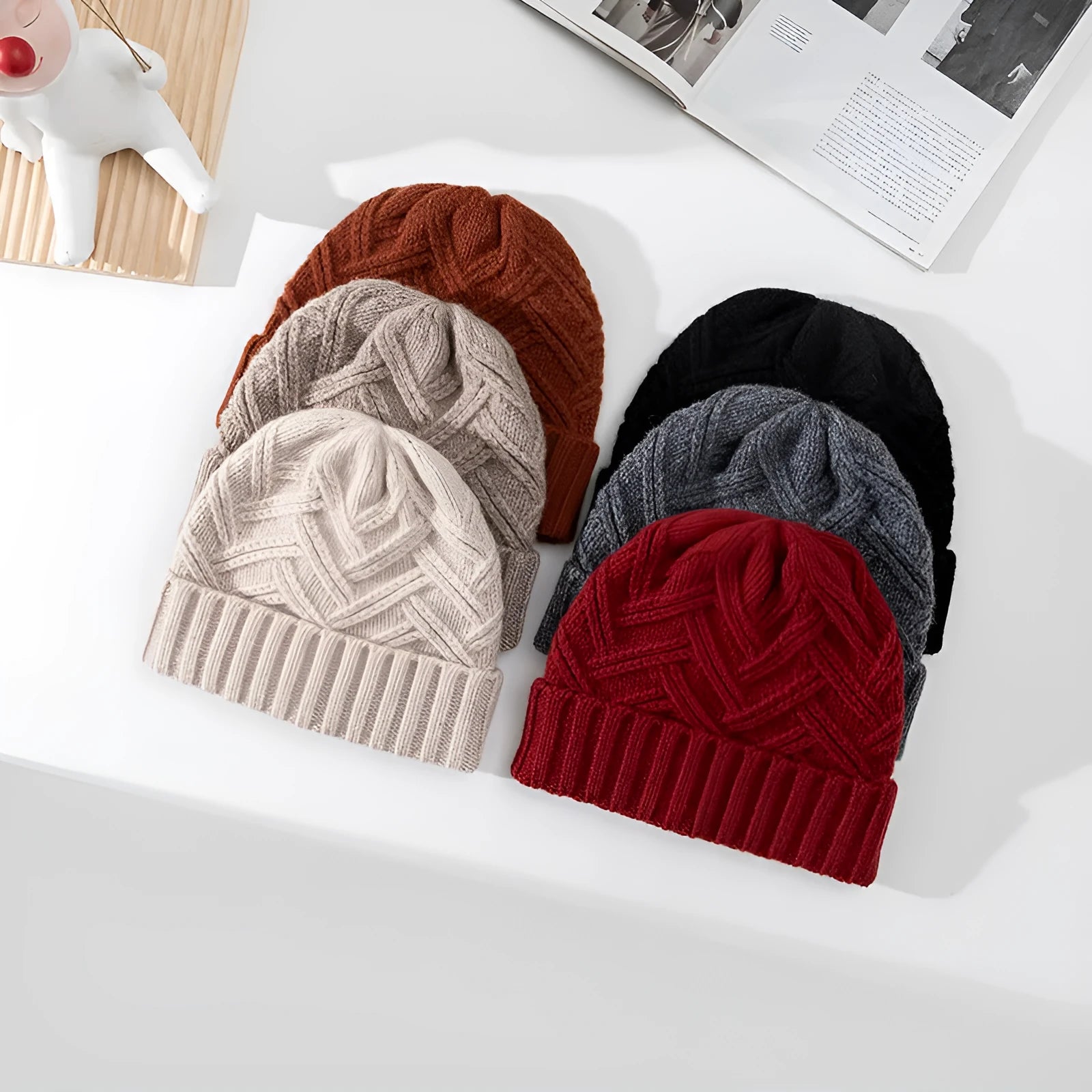 A woman's wool knitted winter hat in a dome crown style, shown in ankela red colour.