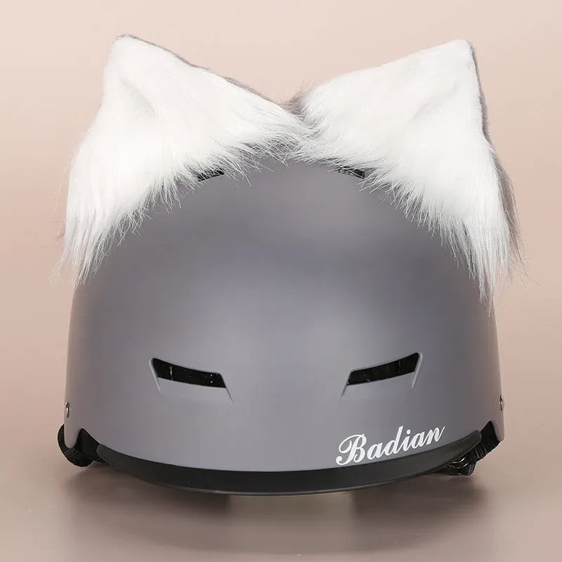 Colourful plush cartoon hat decoration sitting on top of a ski helmet