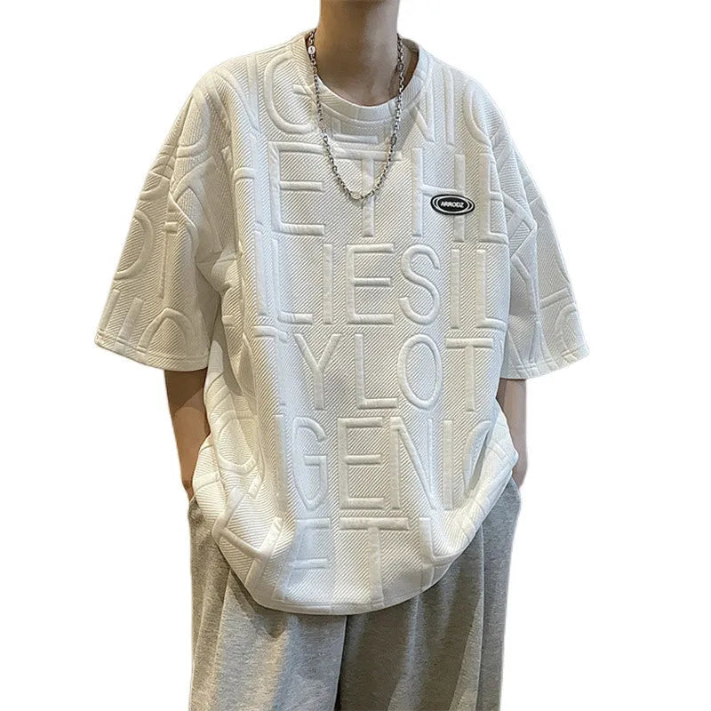 Men's grey loose-fit t-shirt with a raised retro letter print on the chest.