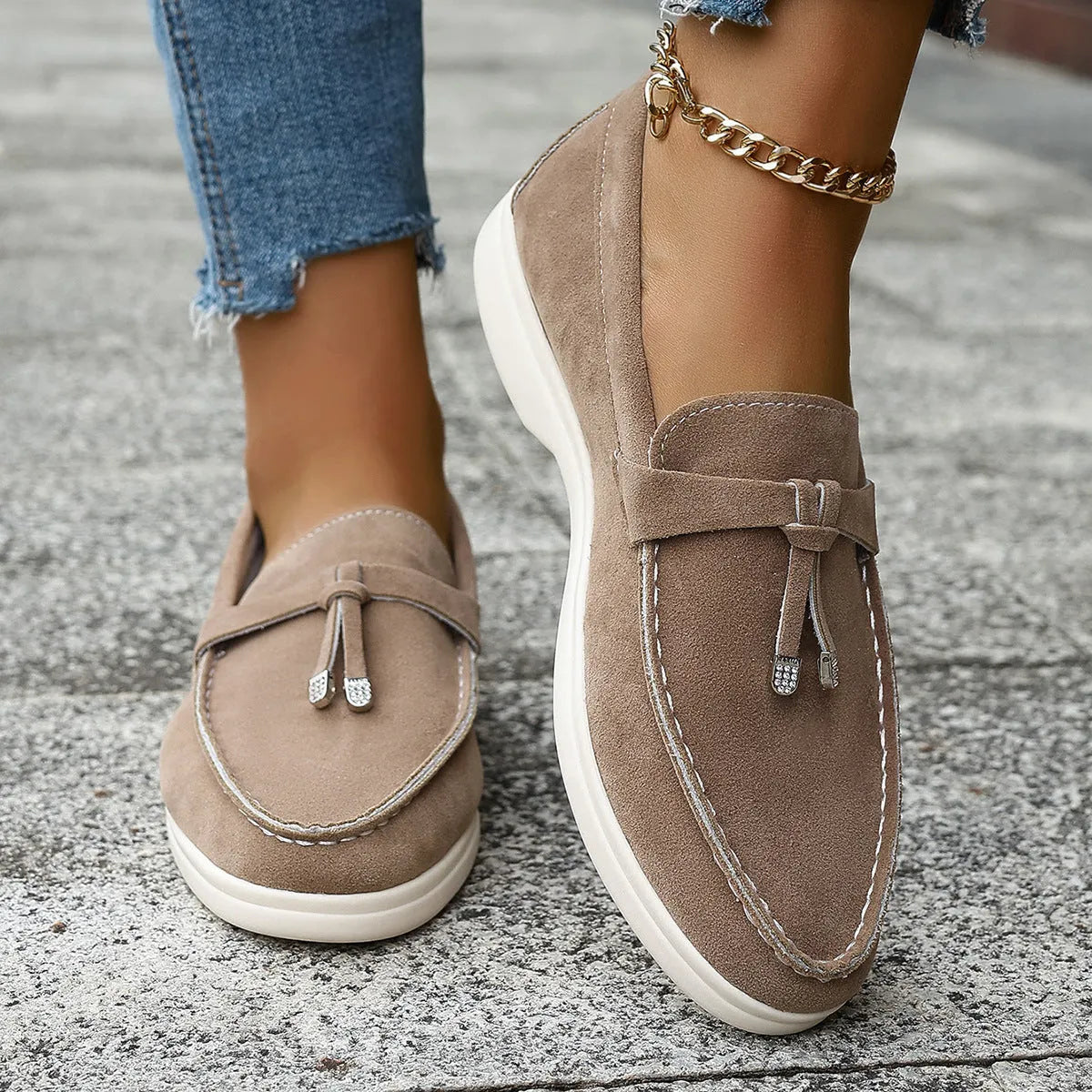 A pair of solid-colour platform slip-on loafers with a round toe and canvas upper.