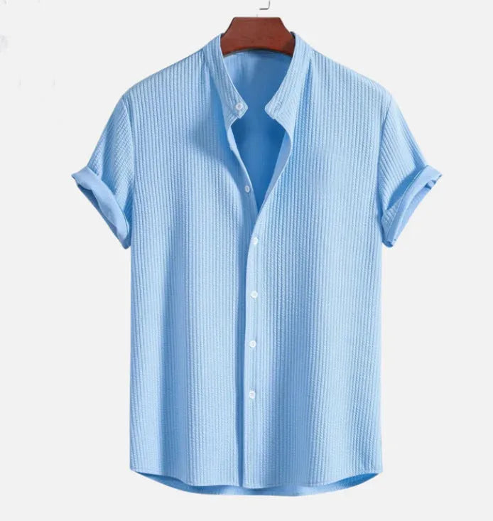 Men's loose fit short sleeve casual shirt in a solid colour on a hanger