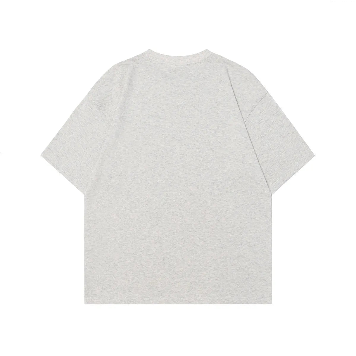 Men's grey loose-fit cotton T-shirt featuring a retro character design print on the front.