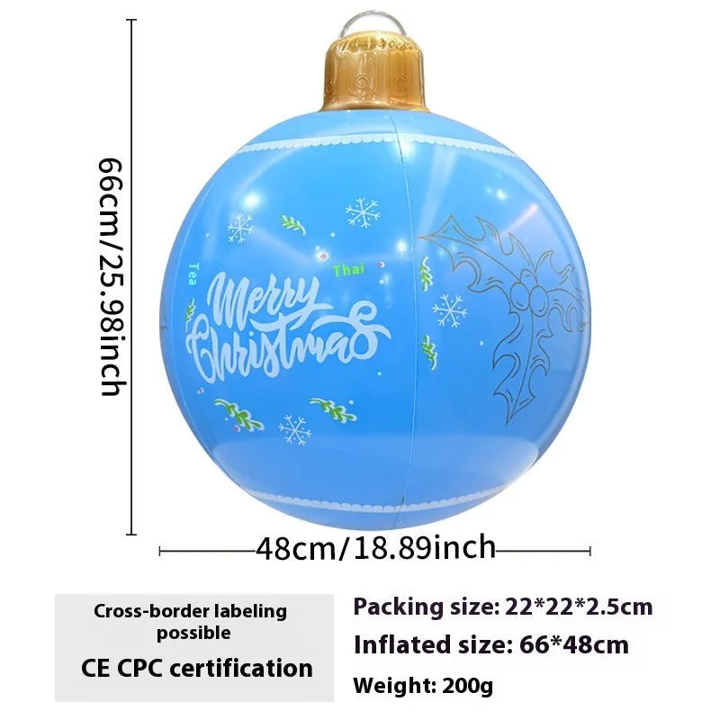 Large red and white inflatable Christmas ball with flashing lights standing in a garden.