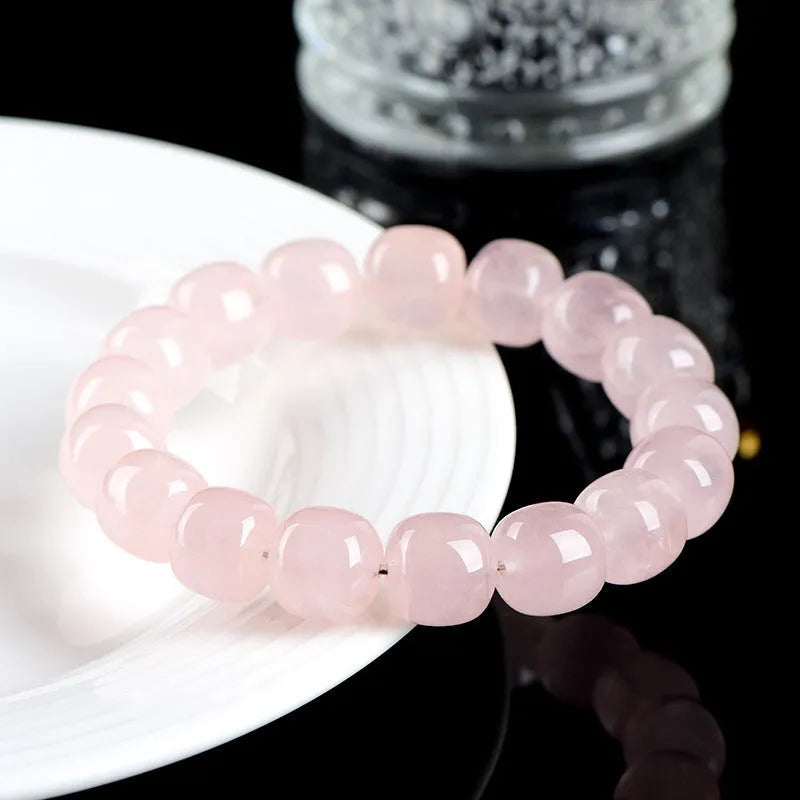 Pink natural bamboo crystal barrel bead bracelet with 11x12mm beads and geometric design.