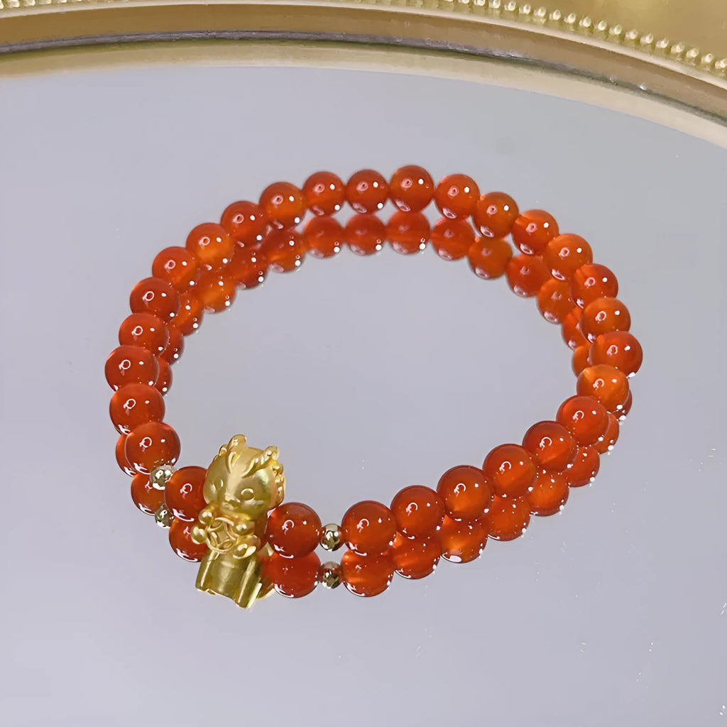 Handcrafted red agate bracelet for women with Chinese dragon design and lucky charm variations