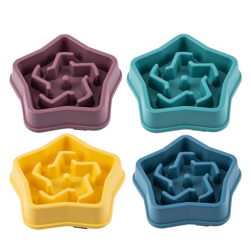 Yellow plastic slow feeding dog bowl with raised pet pattern at bottom