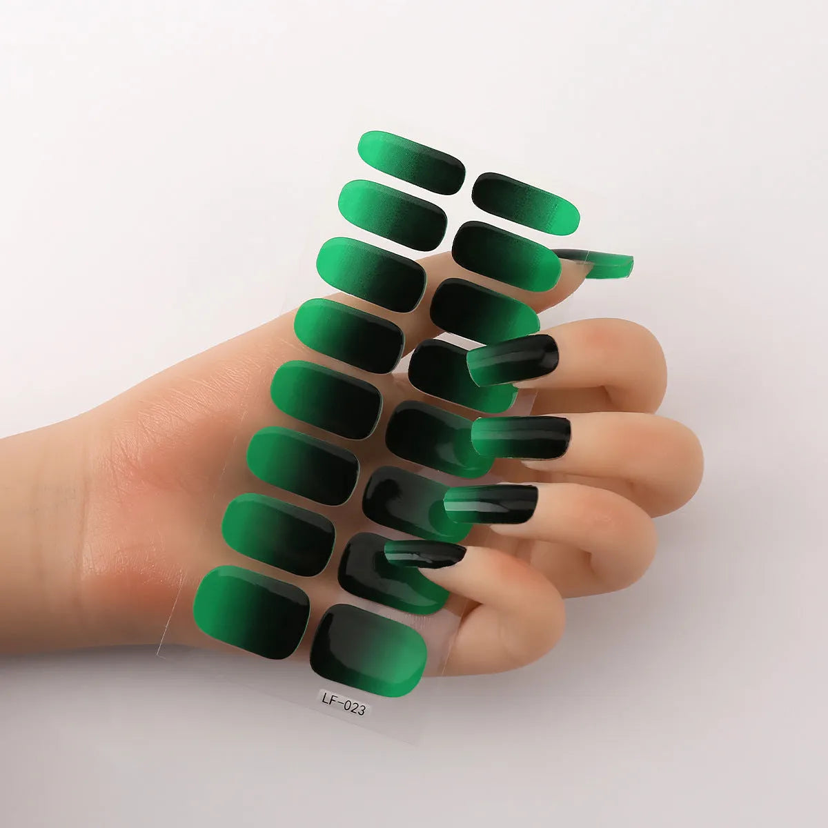 16 solid colour full nail art stickers with 22 patterns including cross, rose, butterfly designs in 12x6mm oval size
