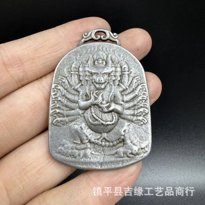 Iron metal pendant with Chinese geometric design depicting Yamantaka Aryaacalanatha deity