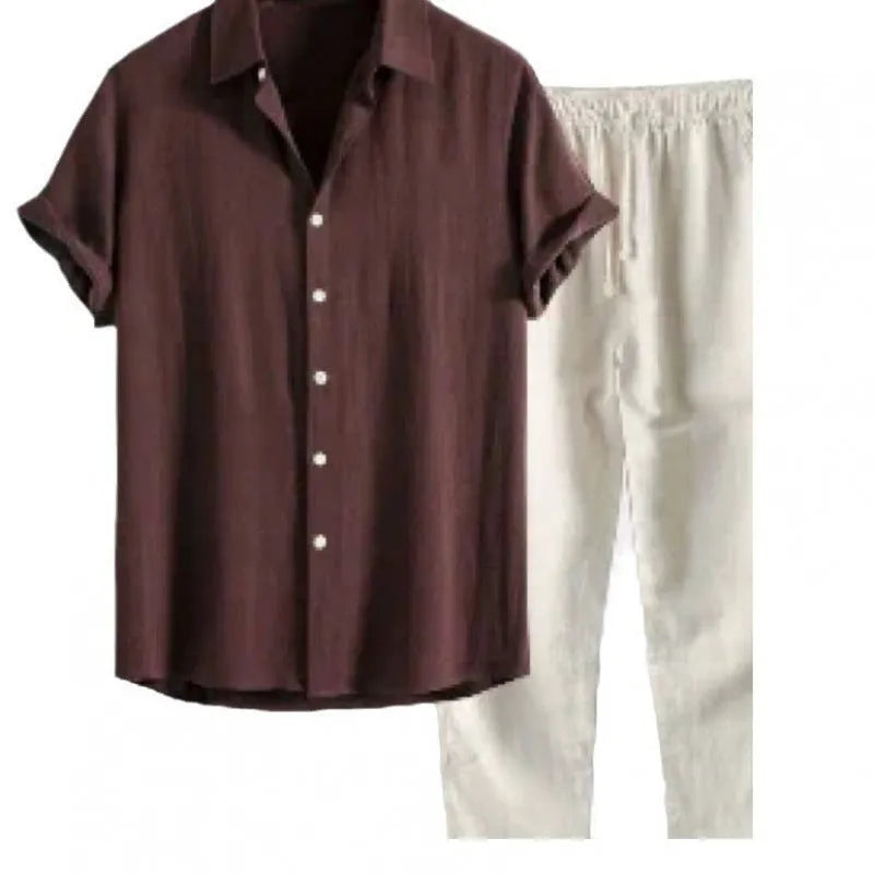 Man wearing a loose-fit short sleeve shirt and matching trousers from a casual linen-look polyester suit.